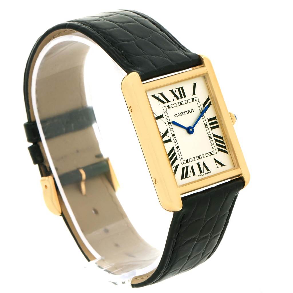 The image shows an oblique view of the Cartier Tank Solo W1018855 Men
s Steel and Gold (two tone) Silver Dial W1018855 Men
s Steel and Gold (two tone) Silver Dial watch, highlighting its rectangular dial, Roman numerals, and black leather strap.