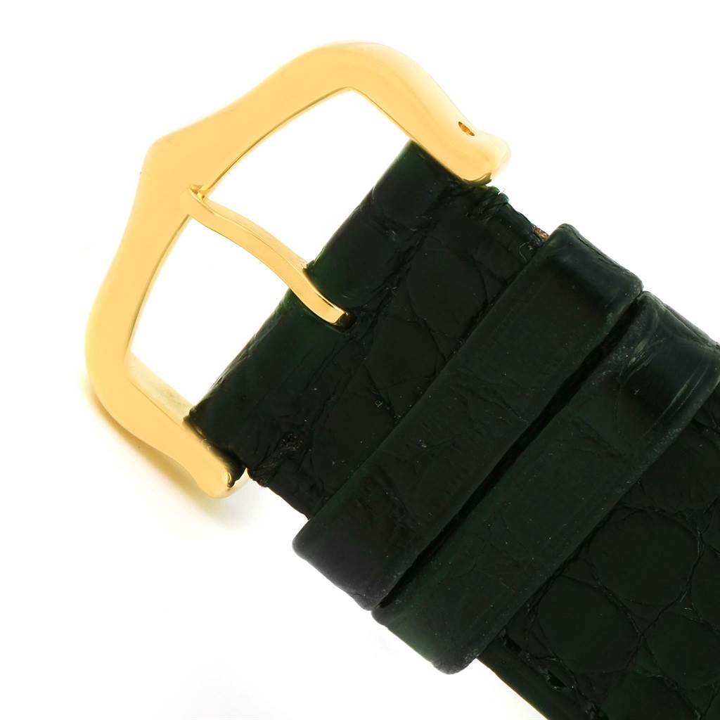 This image shows a close-up of the buckle and leather strap of a Cartier Tank Solo W1018855 Men
s Steel and Gold (two tone) Silver Dial W1018855 Men
s Steel and Gold (two tone) Silver Dial watch.