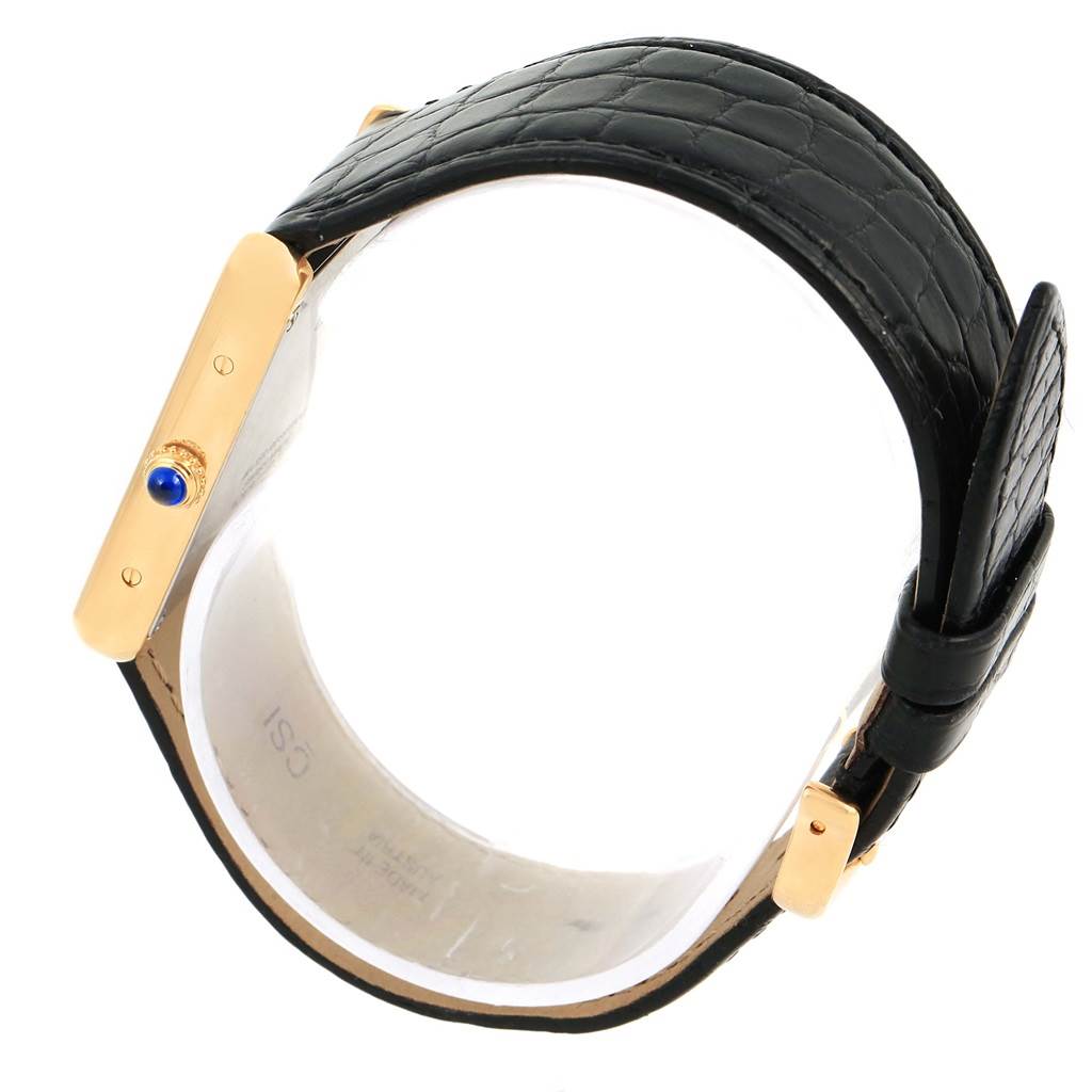 This image shows the Cartier Tank Solo W1018855 Men
s Steel and Gold (two tone) Silver Dial W1018855 Men
s Steel and Gold (two tone) Silver Dial watch from a side angle, highlighting the crown and the black leather strap.