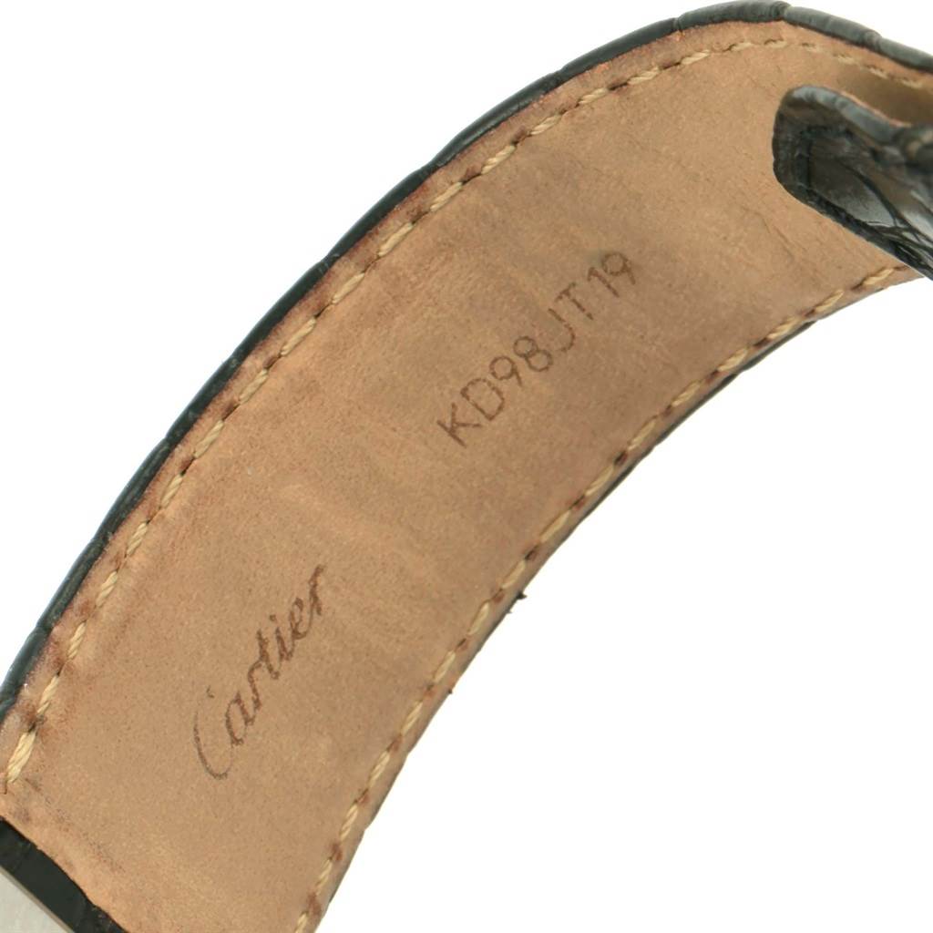 The image shows the inner side of a Cartier Tank Solo W1018355 Men
s Stainless Steel Silver Dial W1018355 Men
s Stainless Steel Silver Dial watch strap with stitching and brand engraving.