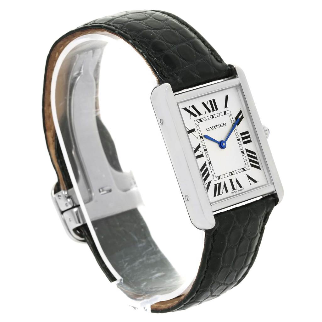 The image shows a Cartier Tank Solo W1018355 Men
s Stainless Steel Silver Dial W1018355 Men
s Stainless Steel Silver Dial watch at a side angle, highlighting its rectangular face, Roman numerals, and black leather strap.