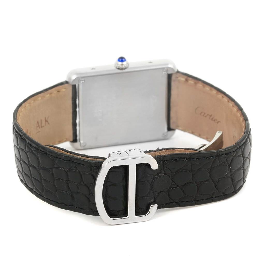 The image shows the back of a Cartier Tank Solo W1018355 Men
s Stainless Steel Silver Dial W1018355 Men
s Stainless Steel Silver Dial watch, showcasing its buckle, strap, and case back.