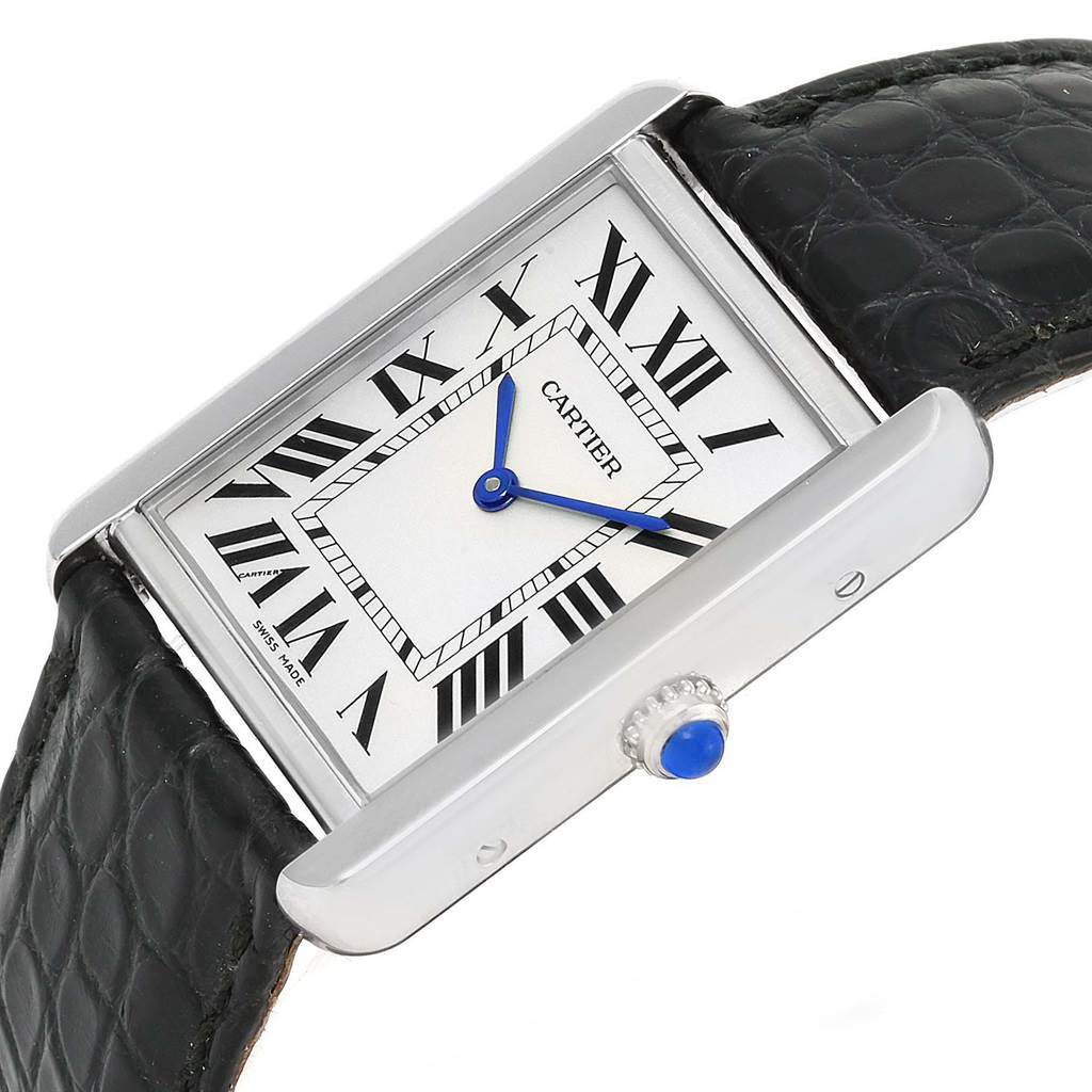 The Cartier Tank Solo W1018355 Men
s Stainless Steel Silver Dial W1018355 Men
s Stainless Steel Silver Dial watch is shown at an angle highlighting its black leather strap, rectangular face, and blue hands.