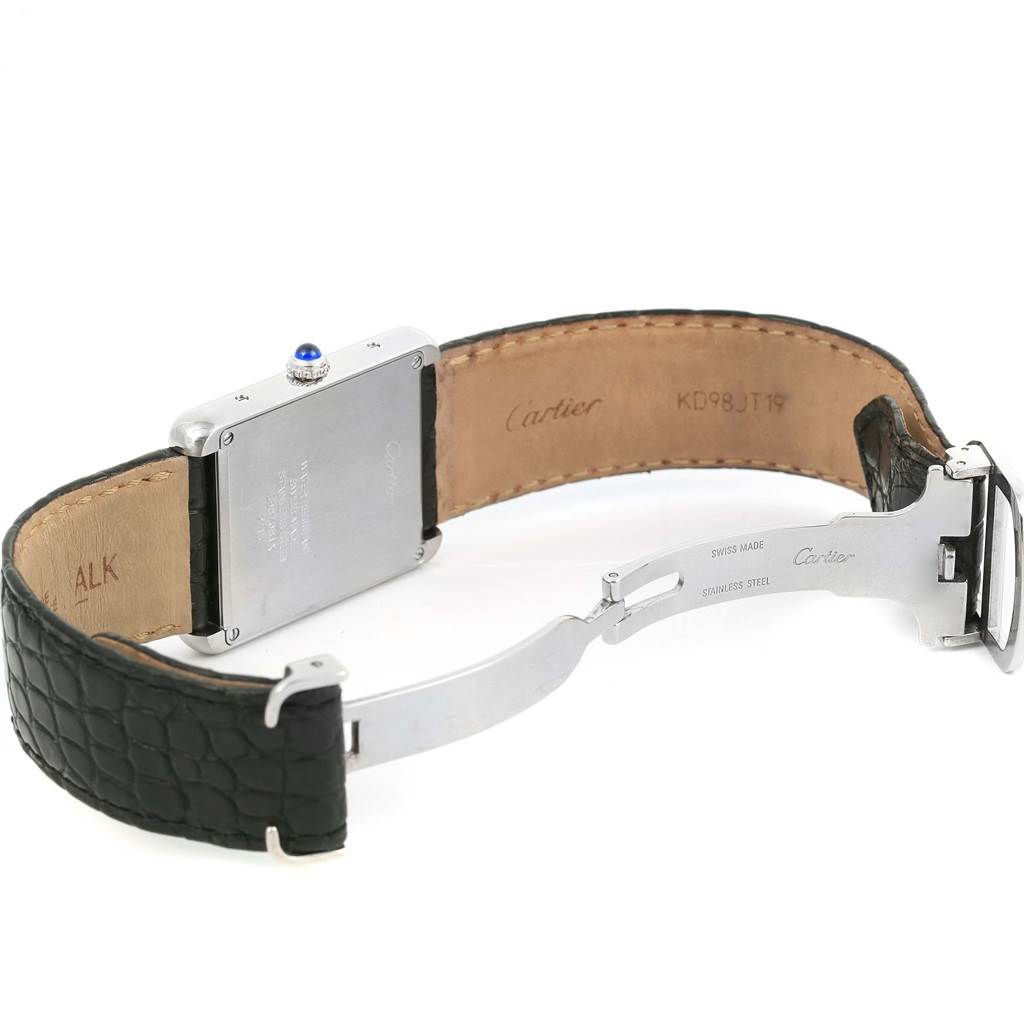 The Cartier Tank Solo W1018355 Men
s Stainless Steel Silver Dial W1018355 Men
s Stainless Steel Silver Dial watch is shown from the back, highlighting the clasp, case back, and black leather strap.