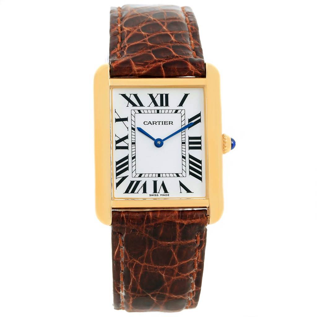 The image shows a Cartier Tank Solo W1018855 Men
s Steel and Gold (two tone) Silver Dial W1018855 Men
s Steel and Gold (two tone) Silver Dial watch from a front view, highlighting its rectangular face, brown leather strap, and gold casing.