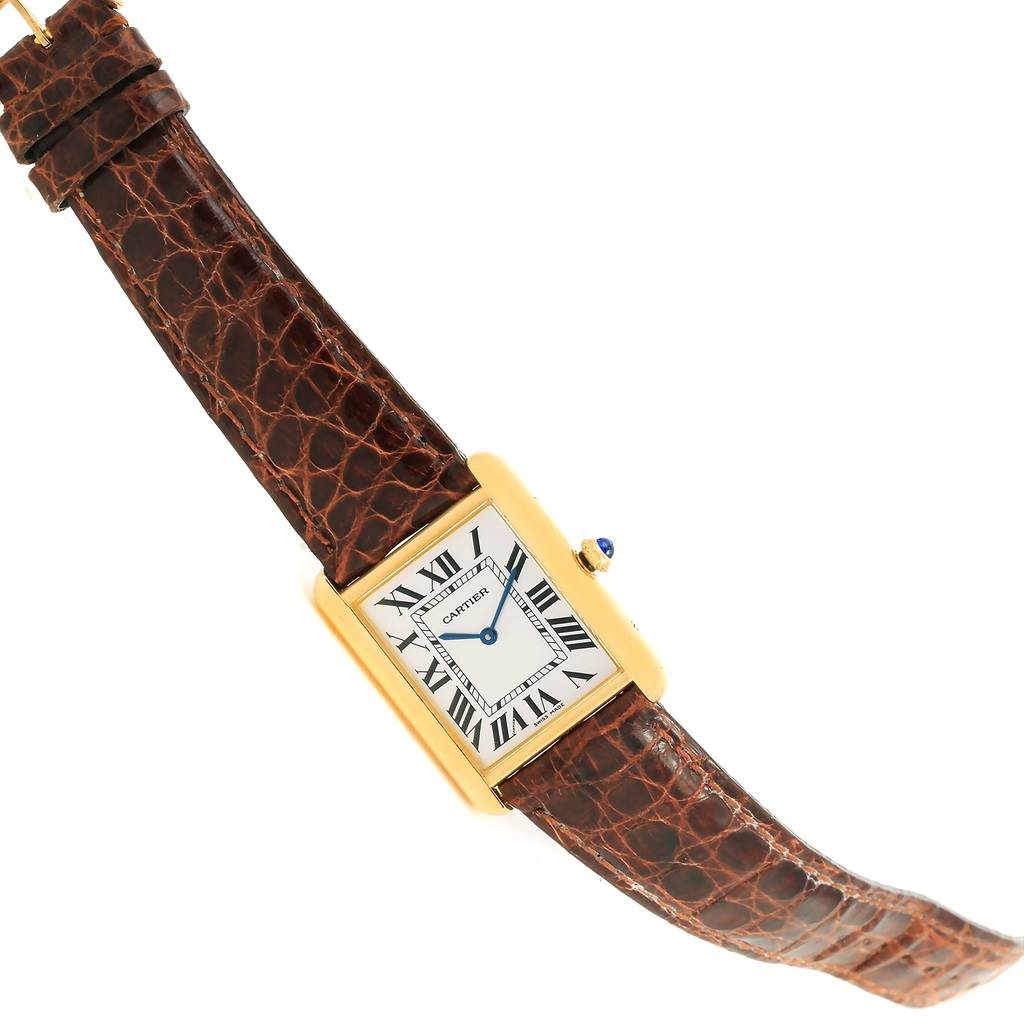 The image shows a Cartier Tank Solo W1018855 Men
s Steel and Gold (two tone) Silver Dial W1018855 Men
s Steel and Gold (two tone) Silver Dial watch at an angled view, displaying its rectangular case, dial, leather strap, and crown.