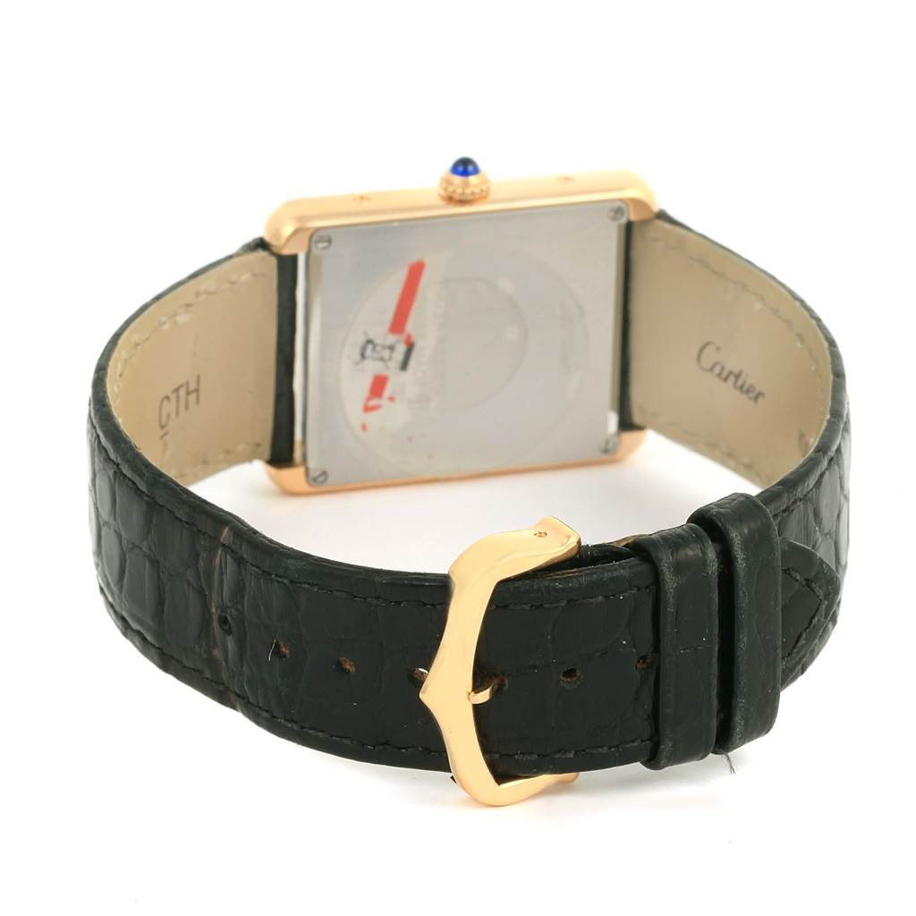 The image shows the rear view and strap of the Cartier Tank Solo W1018855 Men
s Steel and Gold (two tone) Silver Dial W1018855 Men
s Steel and Gold (two tone) Silver Dial watch with a black leather band and gold buckle.