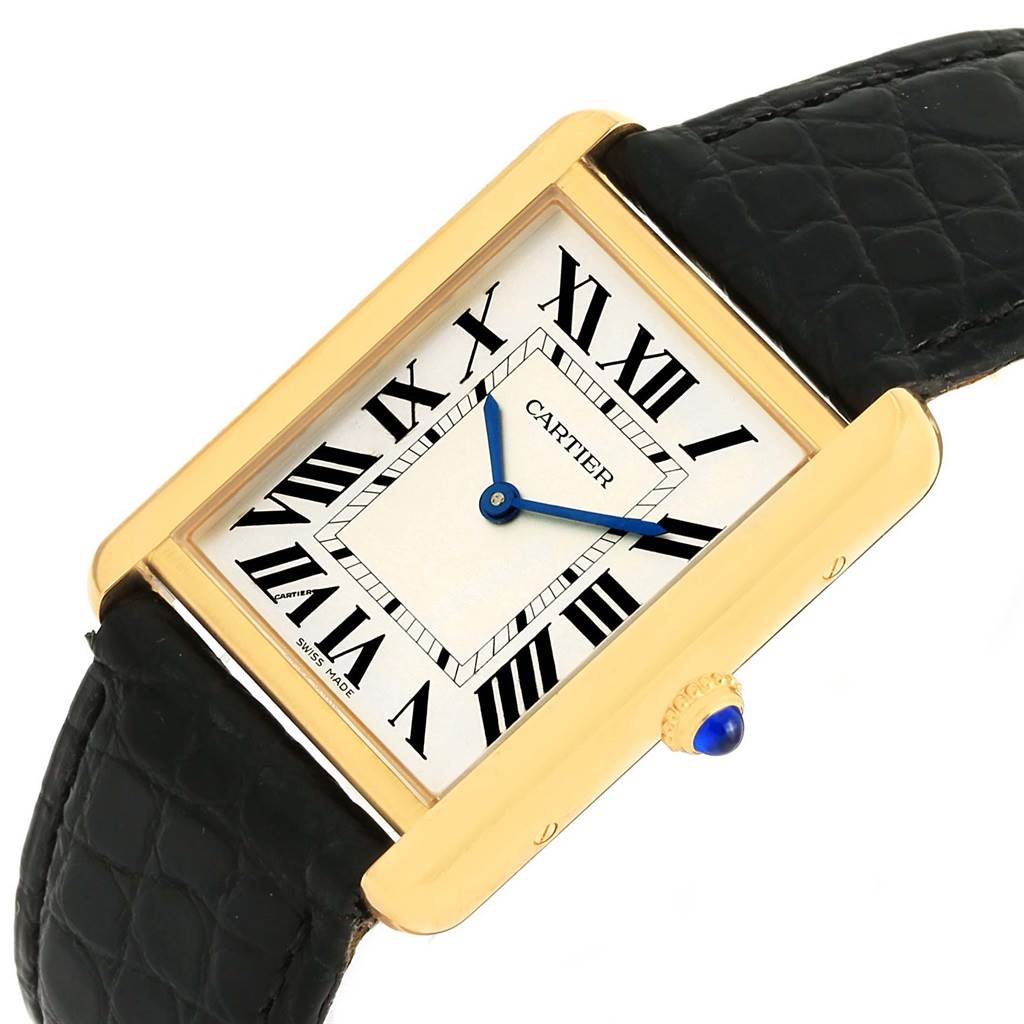 The Cartier Tank Solo W1018855 Men
s Steel and Gold (two tone) Silver Dial W1018855 Men
s Steel and Gold (two tone) Silver Dial watch is shown at an angled front view, displaying its rectangular face, Roman numerals, blue hands, and black leather strap.