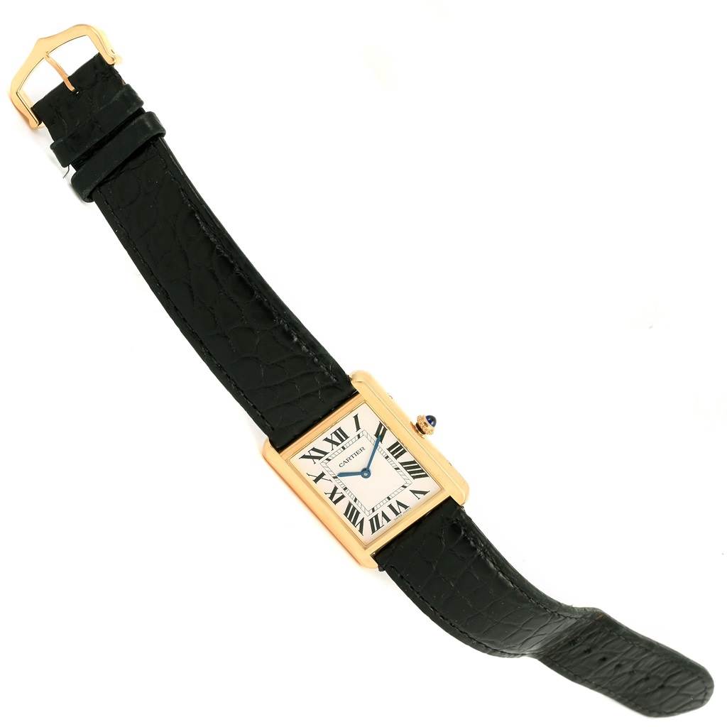 The Cartier Tank Solo W1018855 Men
s Steel and Gold (two tone) Silver Dial W1018855 Men
s Steel and Gold (two tone) Silver Dial watch is pictured at a slight angle, showing the black strap, rectangular dial, gold case, and crown.