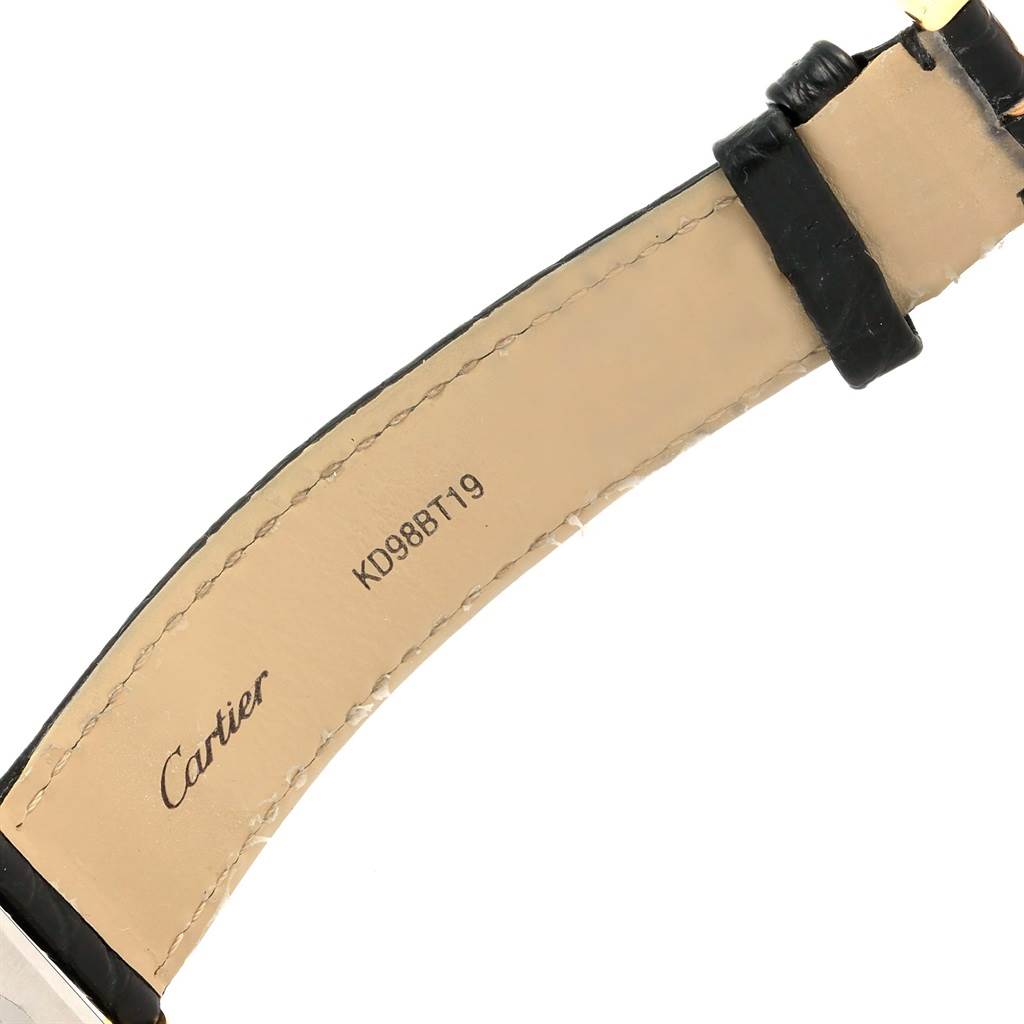 This image shows the underside of a strap for the Cartier Tank Solo W1018855 Men
s Steel and Gold (two tone) Silver Dial W1018855 Men
s Steel and Gold (two tone) Silver Dial watch, featuring the brand name and serial number.