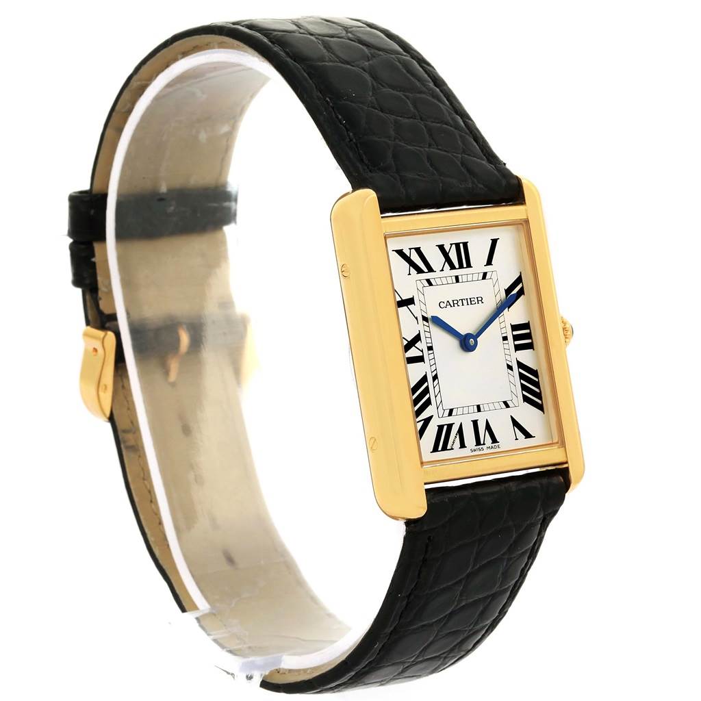 The Cartier Tank Solo W1018855 Men
s Steel and Gold (two tone) Silver Dial W1018855 Men
s Steel and Gold (two tone) Silver Dial watch is shown at an angled side view, showcasing its rectangular case, dial, and black leather strap.