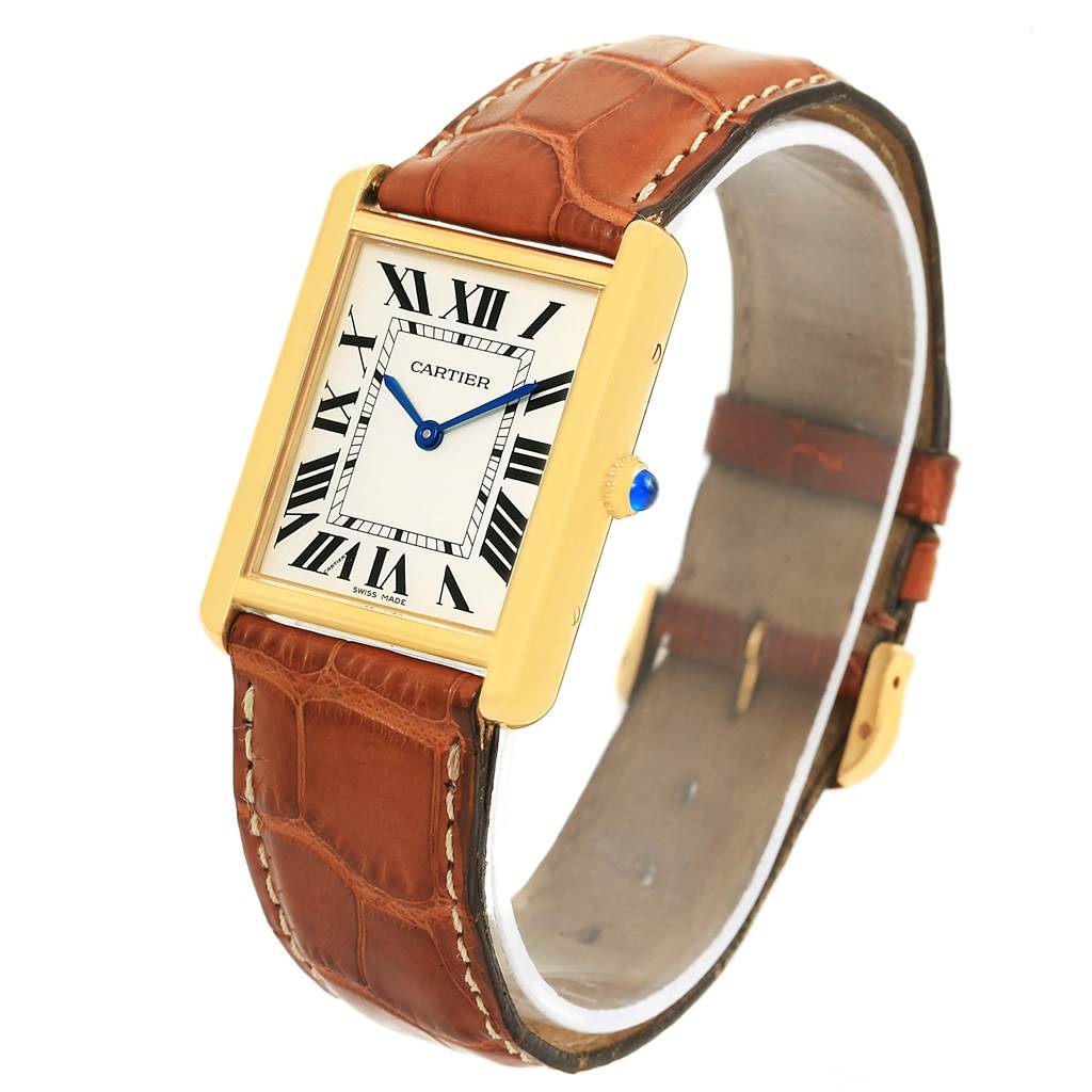 The image shows an angled view of the Cartier Tank Solo W1018855 Men
s Steel and Gold (two tone) Silver Dial W1018855 Men
s Steel and Gold (two tone) Silver Dial watch, highlighting its face and brown leather strap.