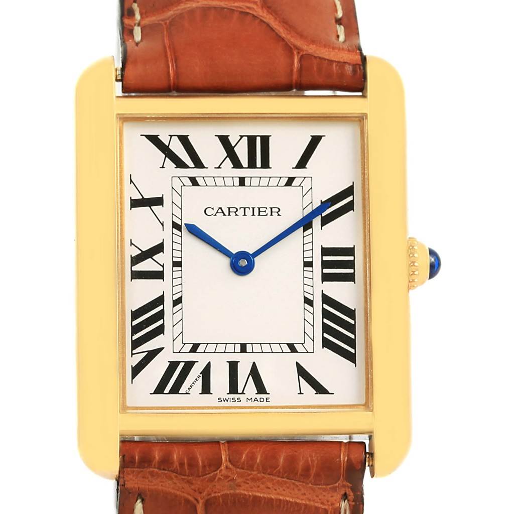 The image shows a front view of the Cartier Tank Solo W1018855 Men
s Steel and Gold (two tone) Silver Dial W1018855 Men
s Steel and Gold (two tone) Silver Dial watch, highlighting its face, hands, bezel, and part of the strap.