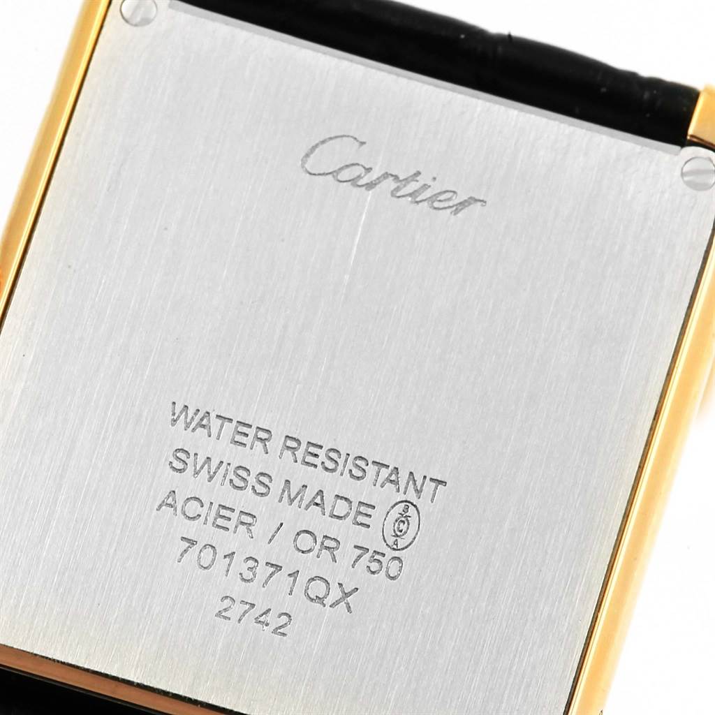 The image shows the engraved back case of a Cartier Tank Solo W1018855 Steel and Gold (two tone) Silver Dial W1018855 Steel and Gold (two tone) Silver Dial watch.