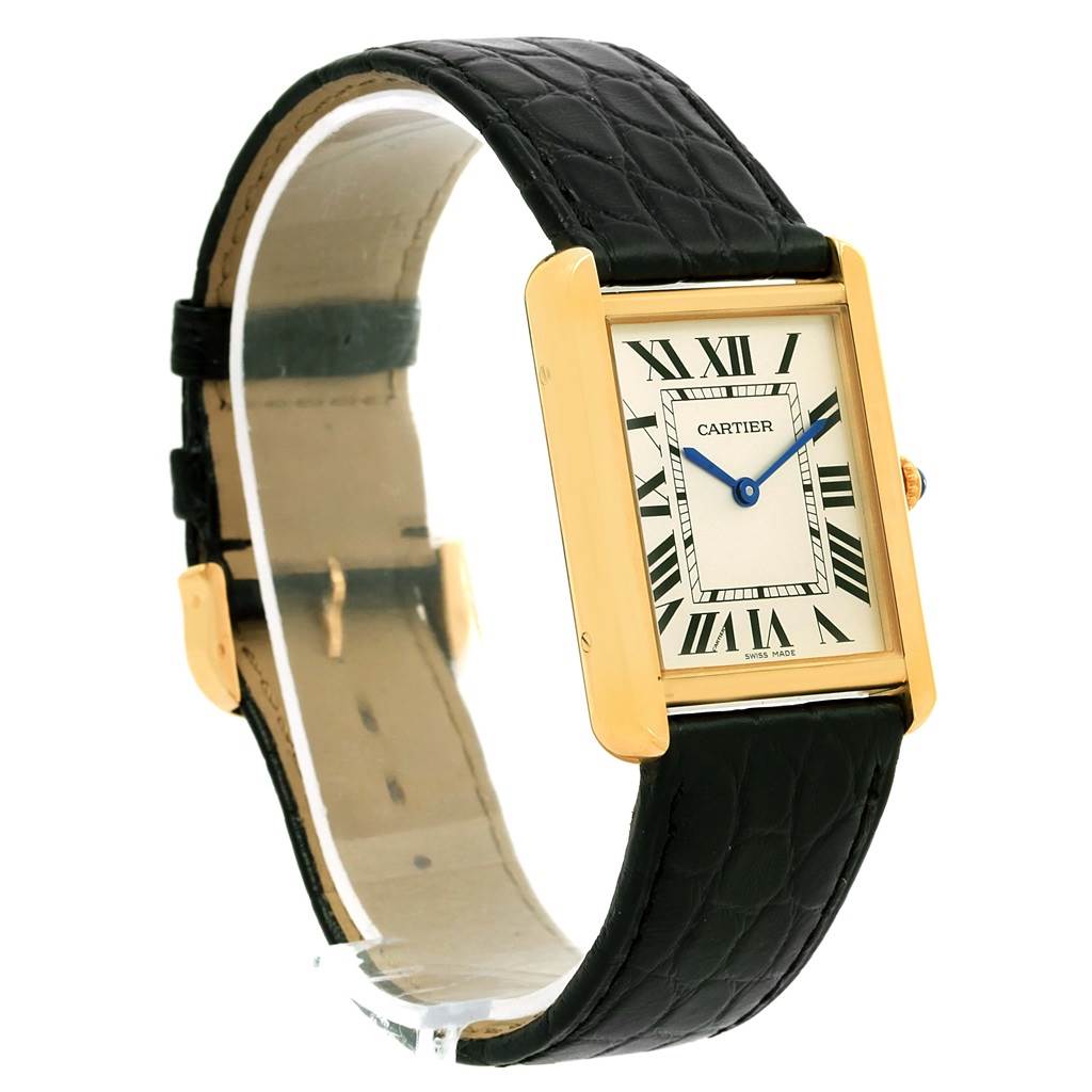 The image shows a Cartier Tank Solo W1018855 Steel and Gold (two tone) Silver Dial W1018855 Steel and Gold (two tone) Silver Dial watch from an angled side view, highlighting its rectangular face, gold case, and black leather strap.