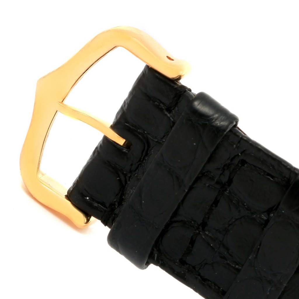 This image shows a close-up of the gold buckle and black leather strap for the Cartier Tank Solo W1018855 Steel and Gold (two tone) Silver Dial W1018855 Steel and Gold (two tone) Silver Dial watch.