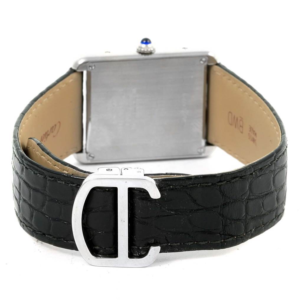 The image shows the back view and buckle of the Cartier Tank Solo W1018355 Stainless Steel Silver Dial W1018355 Stainless Steel Silver Dial watch, highlighting its black leather strap with an embossed pattern.