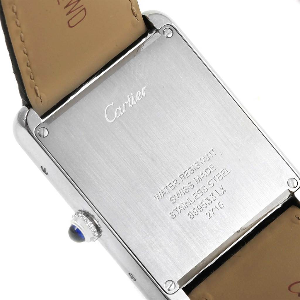 This image shows the back casing and part of the leather strap of the Cartier Tank Solo W1018355 Stainless Steel Silver Dial W1018355 Stainless Steel Silver Dial watch, highlighting its inscriptions.