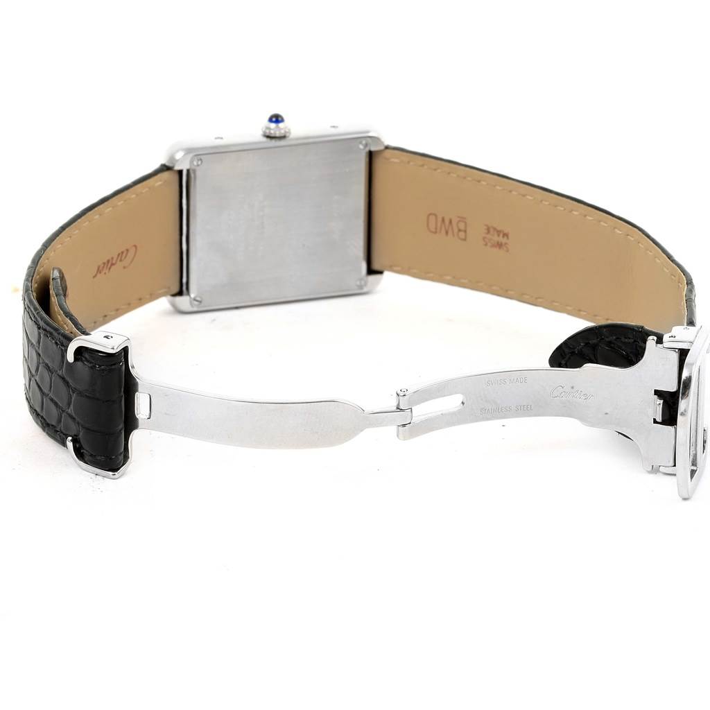 The image shows the back of the Cartier Tank Solo W1018355 Stainless Steel Silver Dial W1018355 Stainless Steel Silver Dial watch with its clasp open and the leather band displayed.