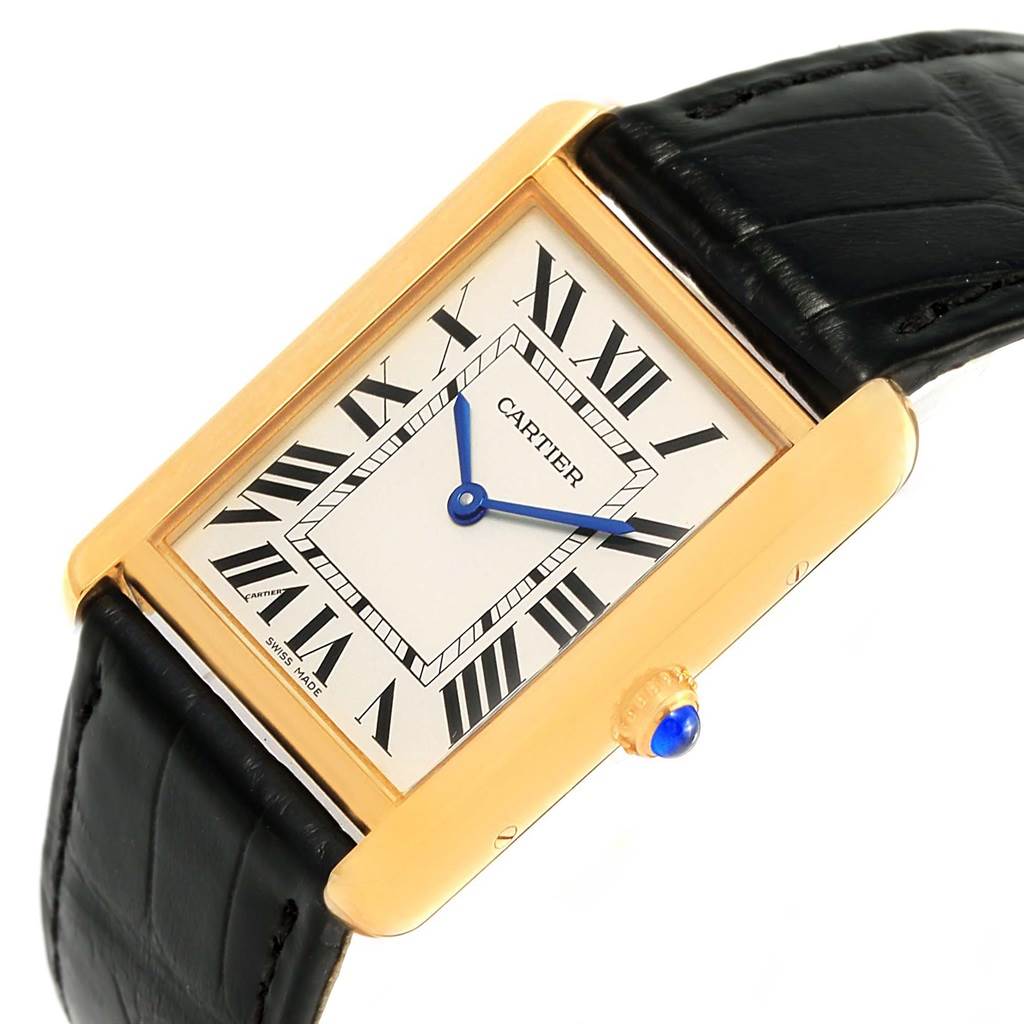 The Cartier Tank Solo W1018855 Steel and Gold (two tone) Silver Dial W1018855 Steel and Gold (two tone) Silver Dial watch is shown at a slight angle, highlighting its rectangular face, Roman numerals, blue hands, and black leather strap.