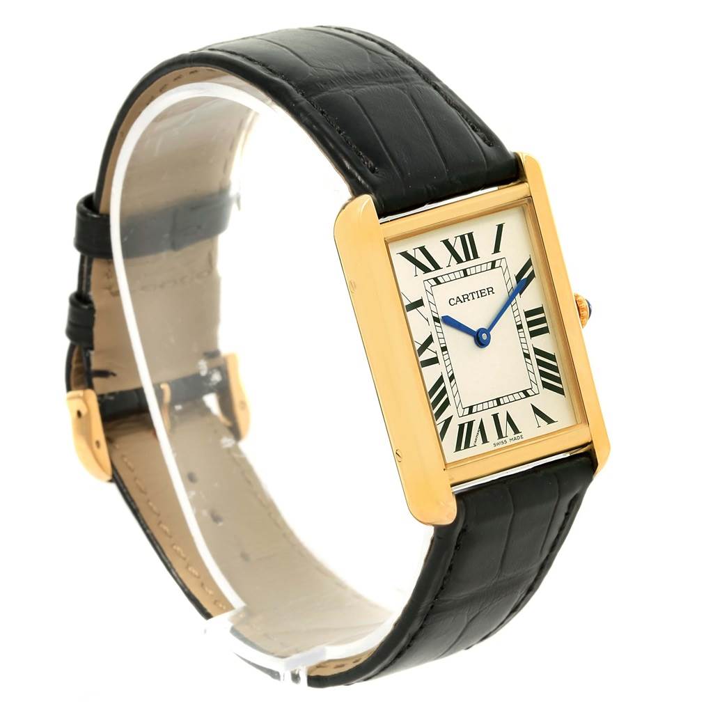 The Cartier Tank Solo W1018855 Steel and Gold (two tone) Silver Dial W1018855 Steel and Gold (two tone) Silver Dial watch is shown at a slight angle, displaying the rectangular case, Roman numeral dial, blue hands, and black leather strap.