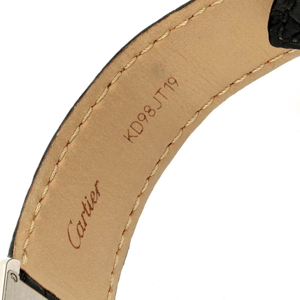 The image shows the inside of the strap of a Cartier Tank Solo W1018355 Men
s Stainless Steel Silver Dial W1018355 Men
s Stainless Steel Silver Dial watch, highlighting the stitching and branding.