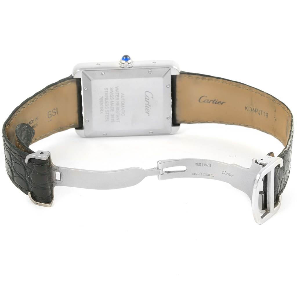 The image shows the back of the Tank Solo watch by Cartier, revealing the clasp, case back, and part of the leather strap.