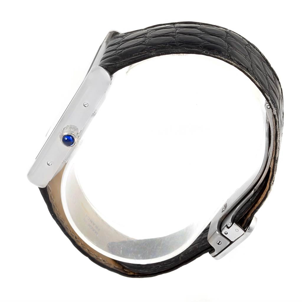 The image shows a side view of the Cartier Tank Solo W5200027 Men
s Stainless Steel Silver Dial W5200027 Men
s Stainless Steel Silver Dial watch, highlighting its case, crown, and black leather strap.