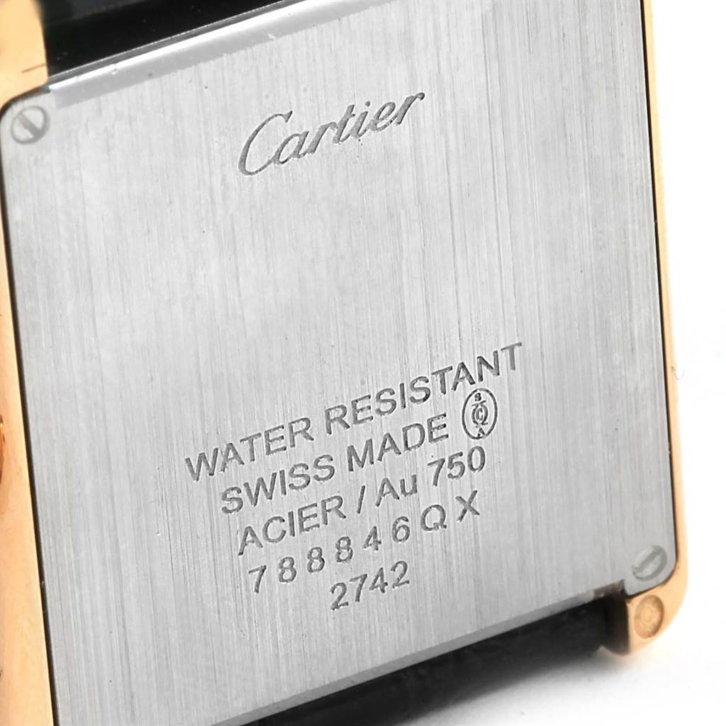 The image shows the back case of a Cartier Tank Solo W1018855 Steel and Gold (two tone) Silver Dial W1018855 Steel and Gold (two tone) Silver Dial watch, highlighting its inscriptions and material details.