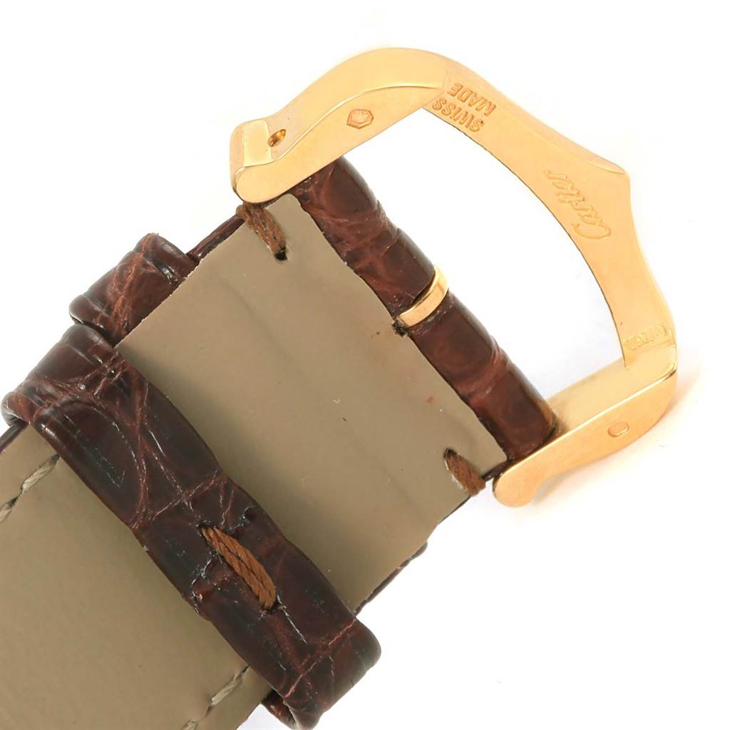 The image shows a close-up of the strap and buckle of a Cartier Tank Solo W1018855 Steel and Gold (two tone) Silver Dial W1018855 Steel and Gold (two tone) Silver Dial watch, highlighting the brown leather and gold clasp.