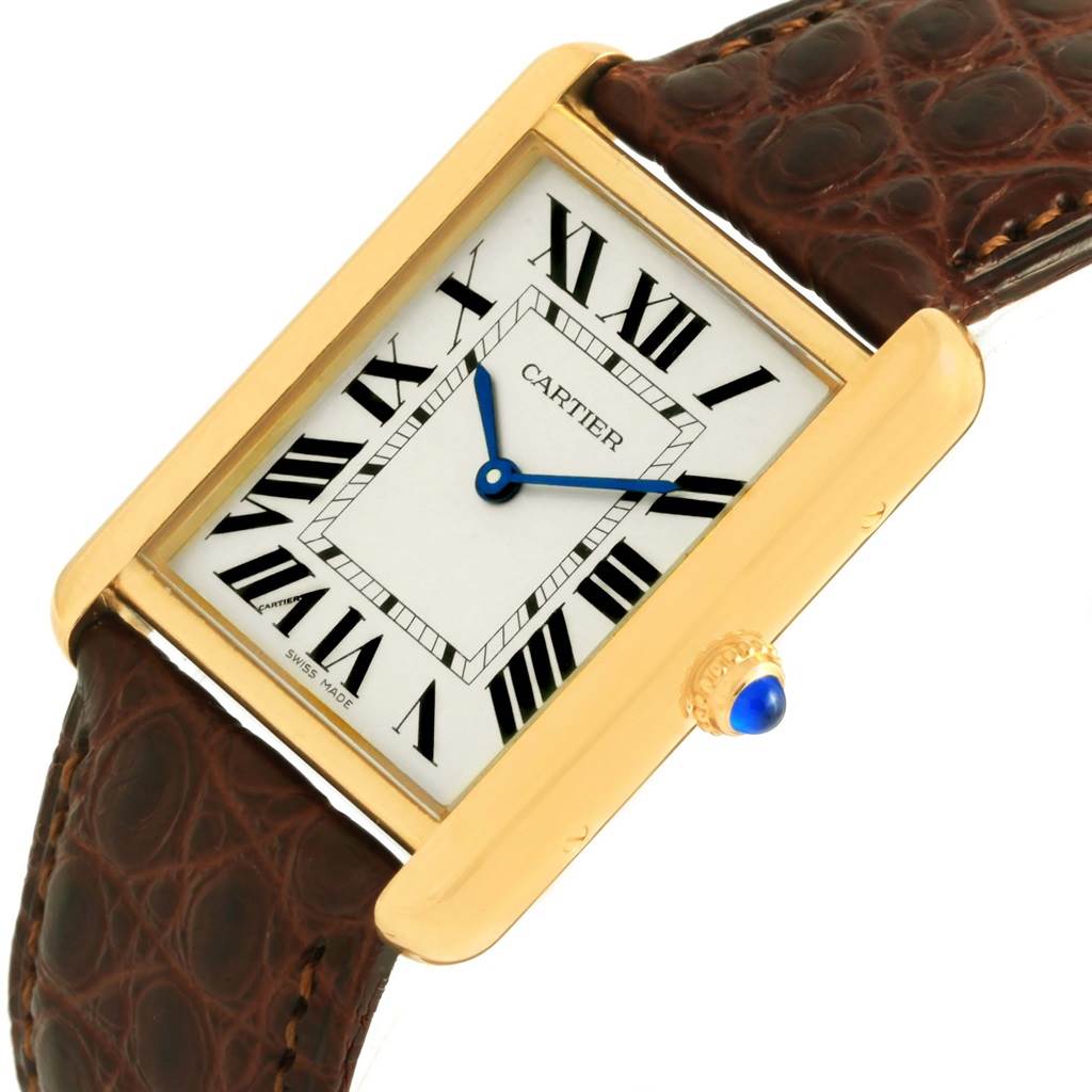 The Cartier Tank Solo W1018855 Steel and Gold (two tone) Silver Dial W1018855 Steel and Gold (two tone) Silver Dial watch is shown at an angle, highlighting its rectangular face, Roman numerals, and leather strap.