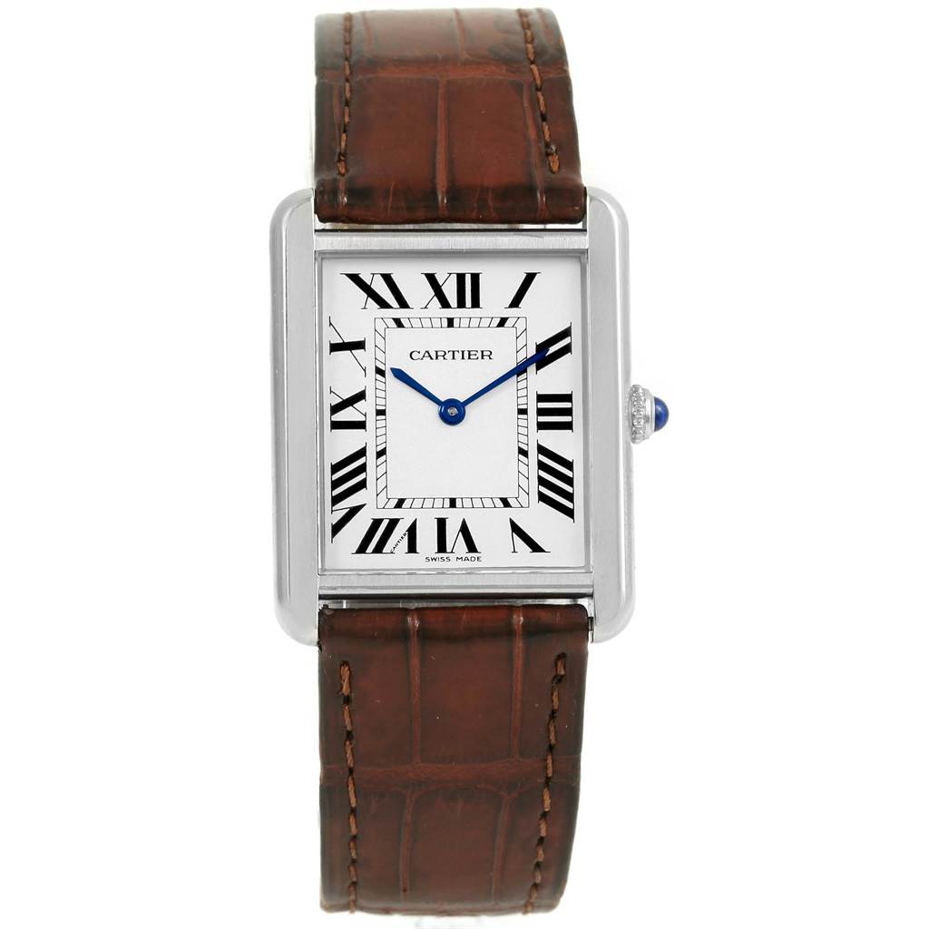 The Cartier Tank Solo W1018355 Stainless Steel Silver Dial W1018355 Stainless Steel Silver Dial watch is shown from a front angle, featuring its rectangular face, Roman numerals, and brown leather strap.