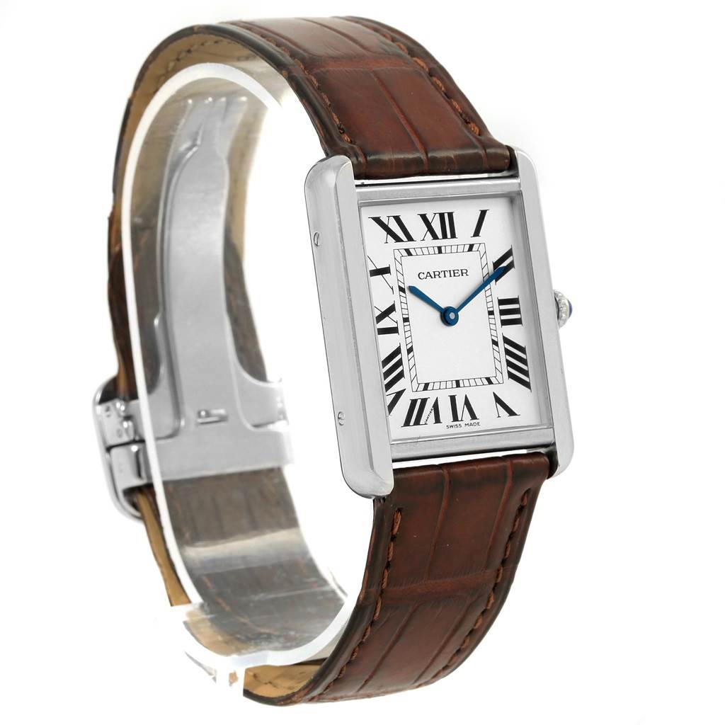 The Cartier Tank Solo W1018355 Stainless Steel Silver Dial W1018355 Stainless Steel Silver Dial watch is shown from a three-quarter angle, highlighting its rectangular face and brown leather strap.