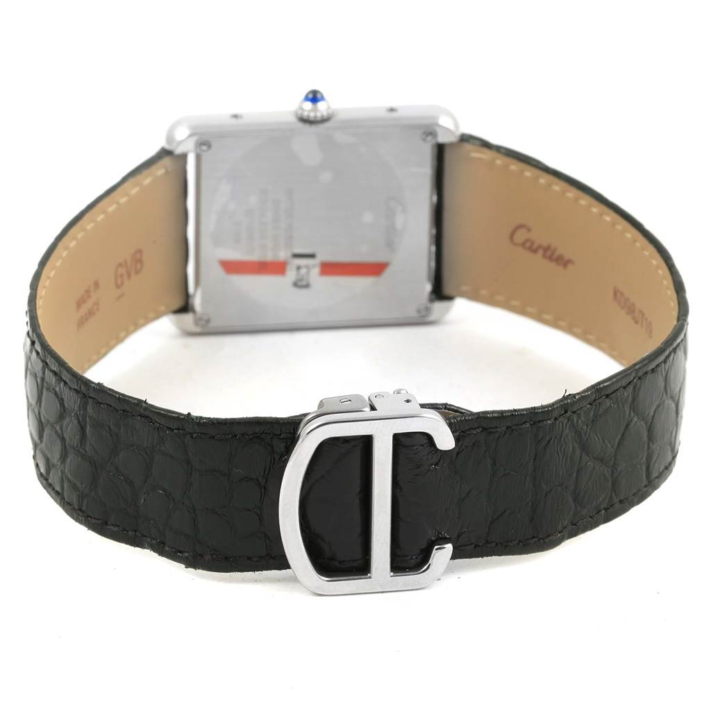 The image shows the back and clasp of a Cartier Tank Solo W1018355 Stainless Steel Silver Dial W1018355 Stainless Steel Silver Dial watch with a black leather strap.