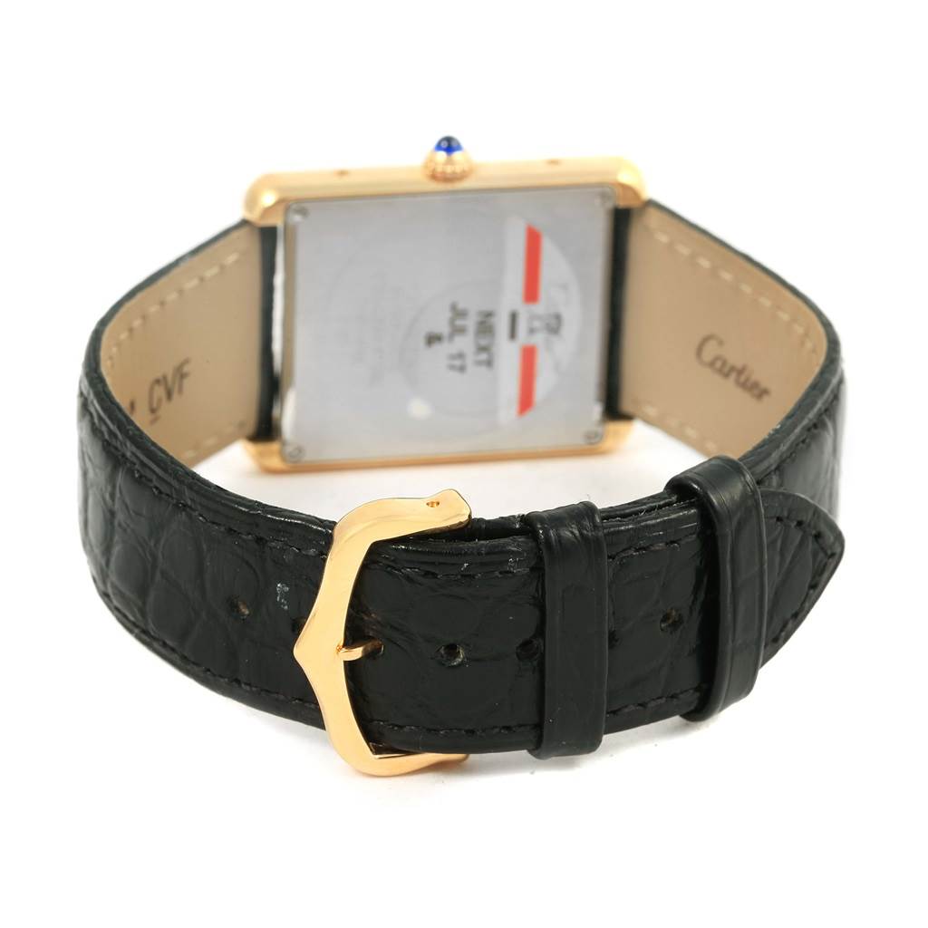 The image shows the back of a Cartier Tank Solo W1018855 Steel and Gold (two tone) Silver Dial W1018855 Steel and Gold (two tone) Silver Dial watch, highlighting the case back, black leather strap, and gold buckle.