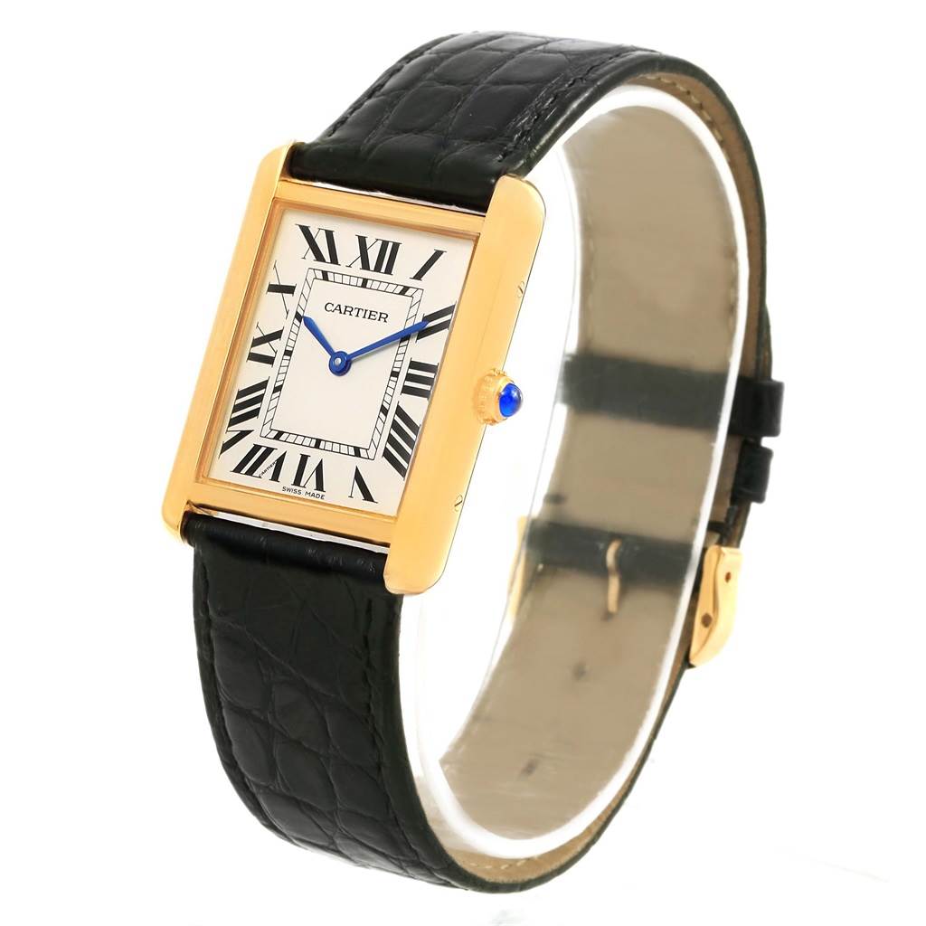 The Cartier Tank Solo W1018855 Steel and Gold (two tone) Silver Dial W1018855 Steel and Gold (two tone) Silver Dial watch is shown at an angle highlighting the face, crown, and black leather strap.