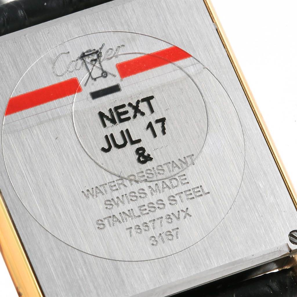 The image shows the back of the Cartier Tank Solo W1018855 Steel and Gold (two tone) Silver Dial W1018855 Steel and Gold (two tone) Silver Dial watch, highlighting its engraved details and branding.