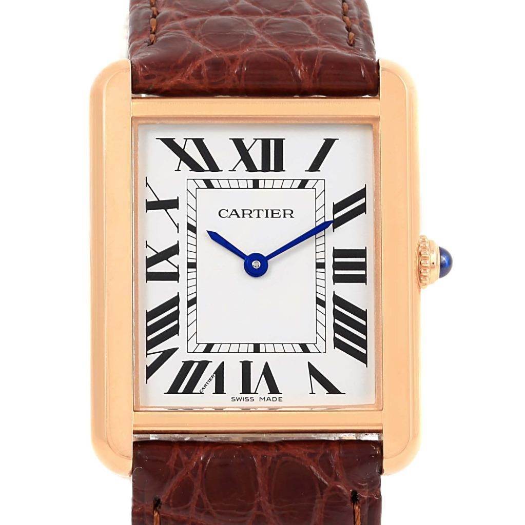 The image shows a front view of the Cartier Tank Solo W5200025 Steel and Gold (two tone) Silver Dial W5200025 Steel and Gold (two tone) Silver Dial watch, highlighting its rectangular face, Roman numeral markers, and leather strap.
