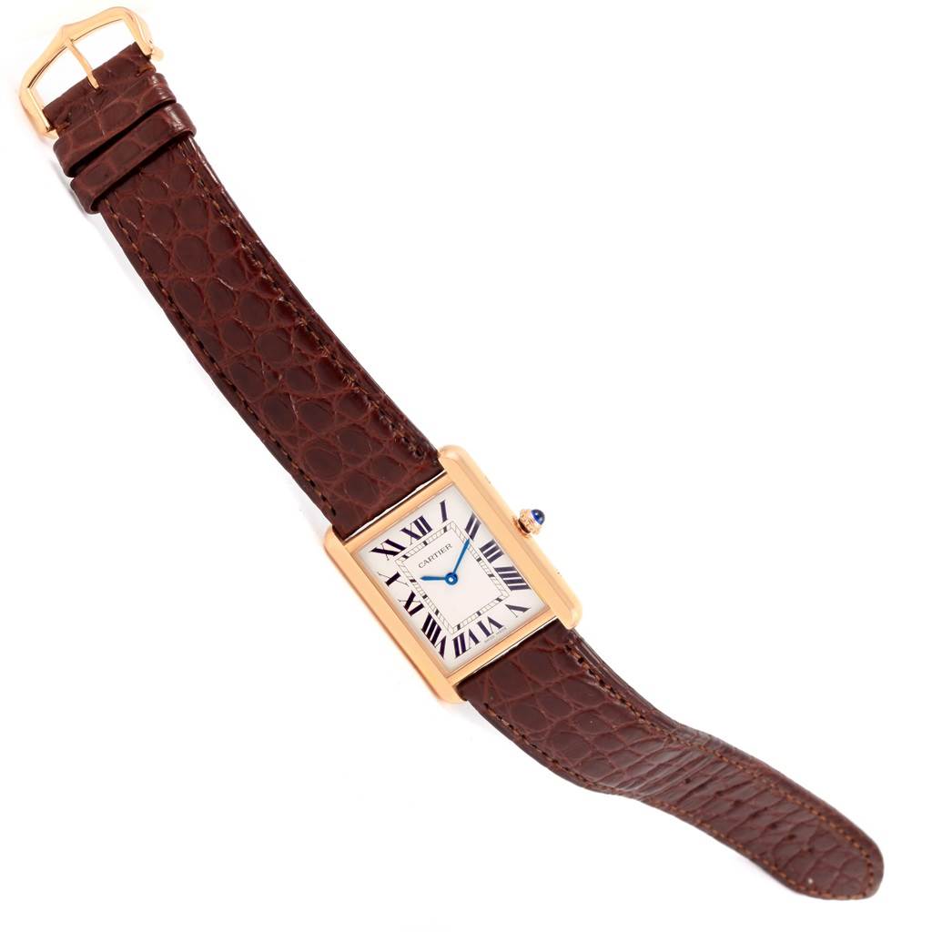 The image shows a top-down view of a Cartier Tank Solo W5200025 Steel and Gold (two tone) Silver Dial W5200025 Steel and Gold (two tone) Silver Dial watch, featuring a brown leather strap and a rectangular dial with Roman numerals.