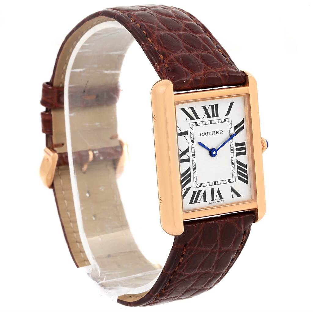 The Tank Solo model by Cartier is shown at a slight angle, displaying its face, Roman numeral dial, and brown leather strap.