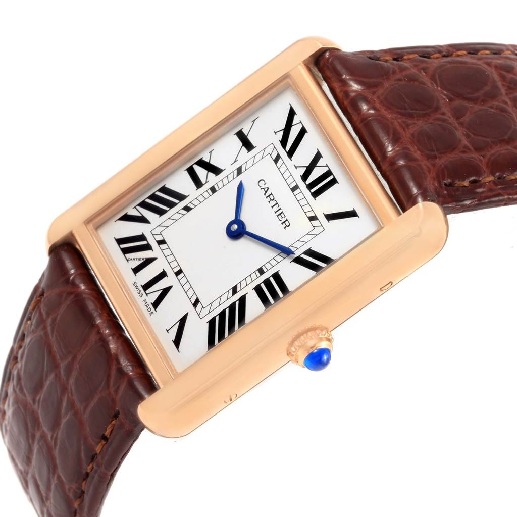 This image shows a Cartier Tank Solo W5200025 Steel and Gold (two tone) Silver Dial W5200025 Steel and Gold (two tone) Silver Dial watch at an angled view, highlighting its rectangular face, Roman numerals, and brown leather strap.