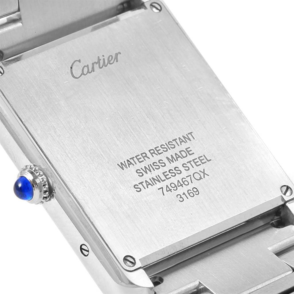 The image shows the back case of the Cartier Tank Solo W5200014 Men
s Stainless Steel Silver Dial W5200014 Men
s Stainless Steel Silver Dial watch, highlighting details of its water resistance and stainless steel composition.