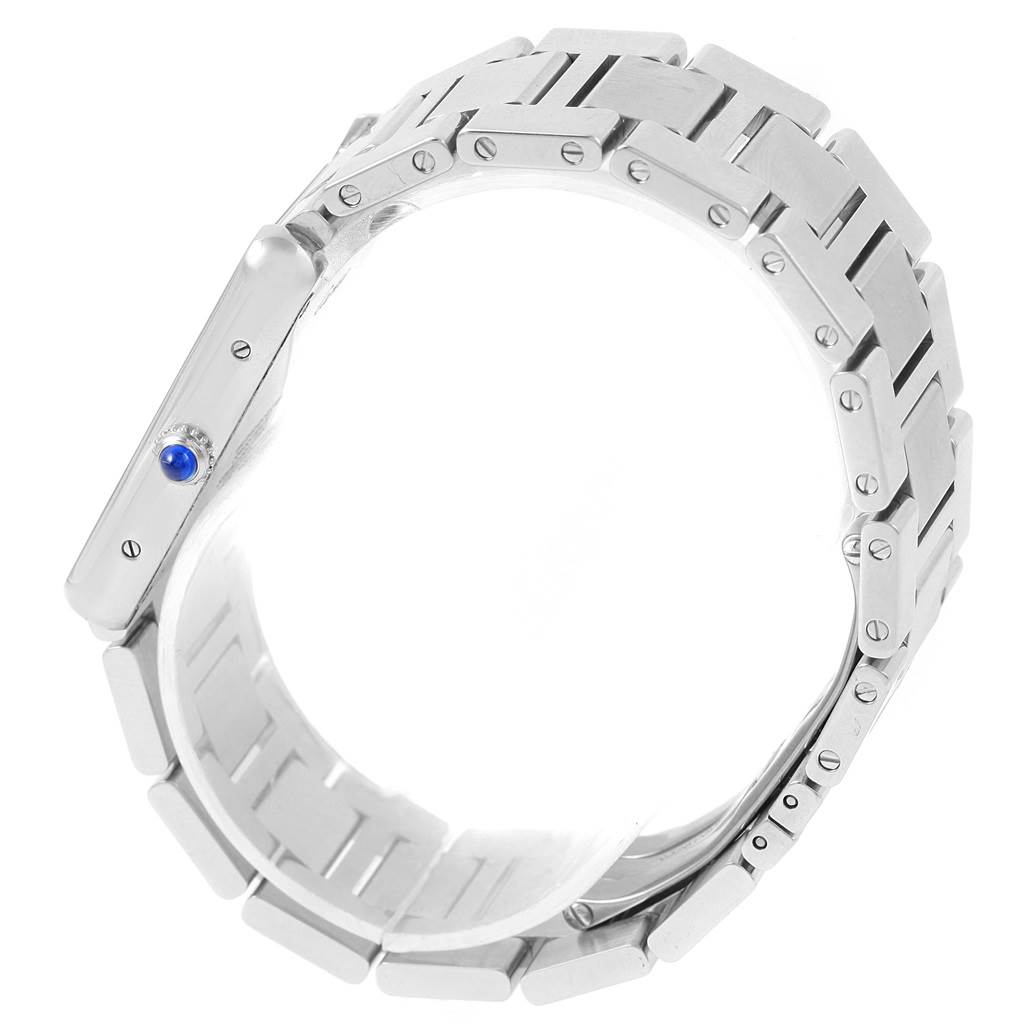 The image shows a side view of the Cartier Tank Solo W5200014 Men
s Stainless Steel Silver Dial W5200014 Men
s Stainless Steel Silver Dial watch, focusing on its metallic bracelet and blue cabochon crown.