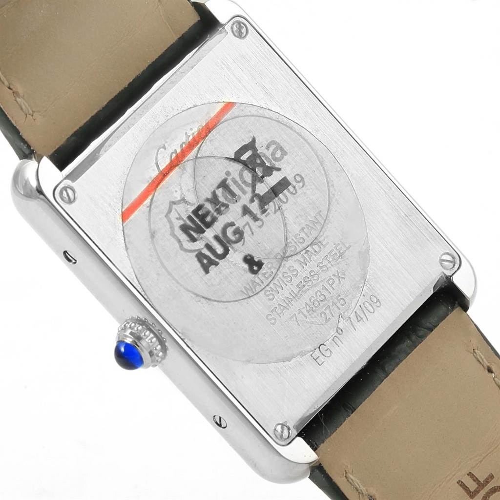 The image shows the back of a Cartier Tank Solo W1018355 Stainless Steel Silver Dial W1018355 Stainless Steel Silver Dial watch, displaying its case back, screws, and crown with a blue cabochon.