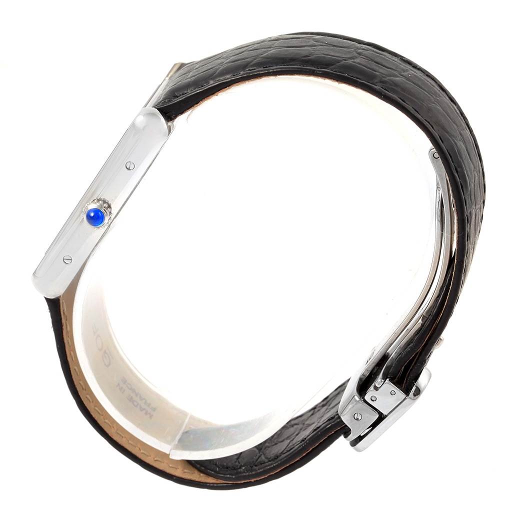 The image shows a side view of a Tank Solo model by Cartier, focusing on the watch
s case, crown, and strap.