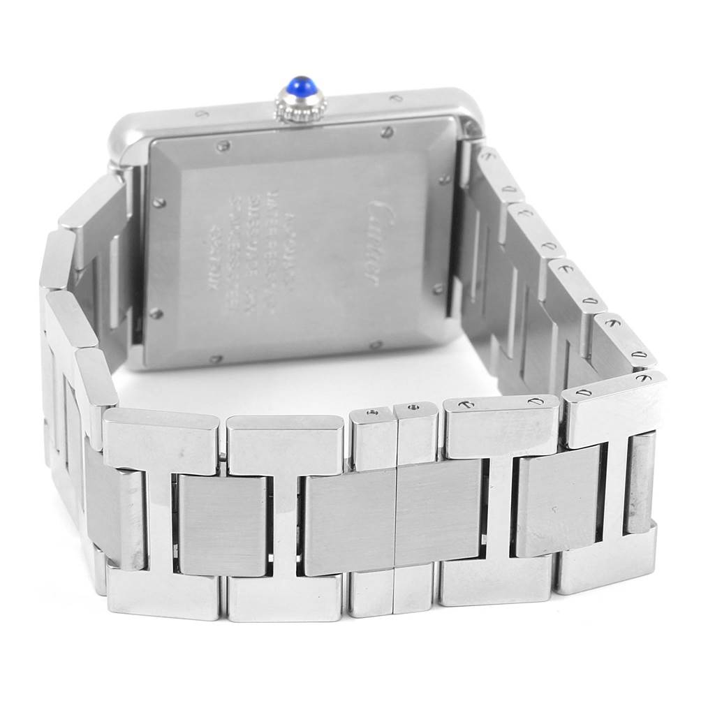 The image shows the back of a Cartier Tank Solo W5200028 Men
s Stainless Steel Silver Dial W5200028 Men
s Stainless Steel Silver Dial watch, highlighting the case back and stainless steel bracelet.