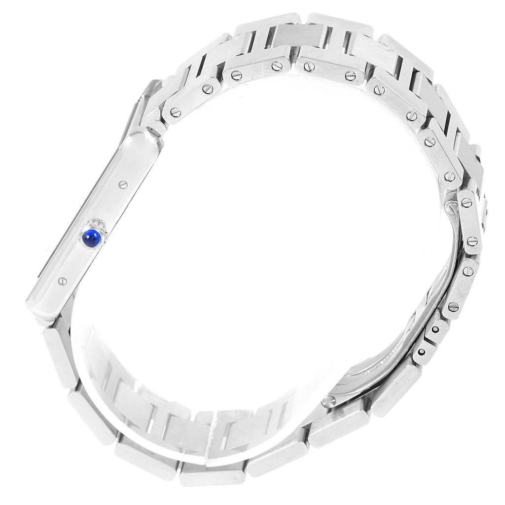 This image shows a side view of the Cartier Tank Solo W5200014 Stainless Steel Silver Dial W5200014 Stainless Steel Silver Dial watch, focusing on its stainless steel bracelet and crown with a blue cabochon.