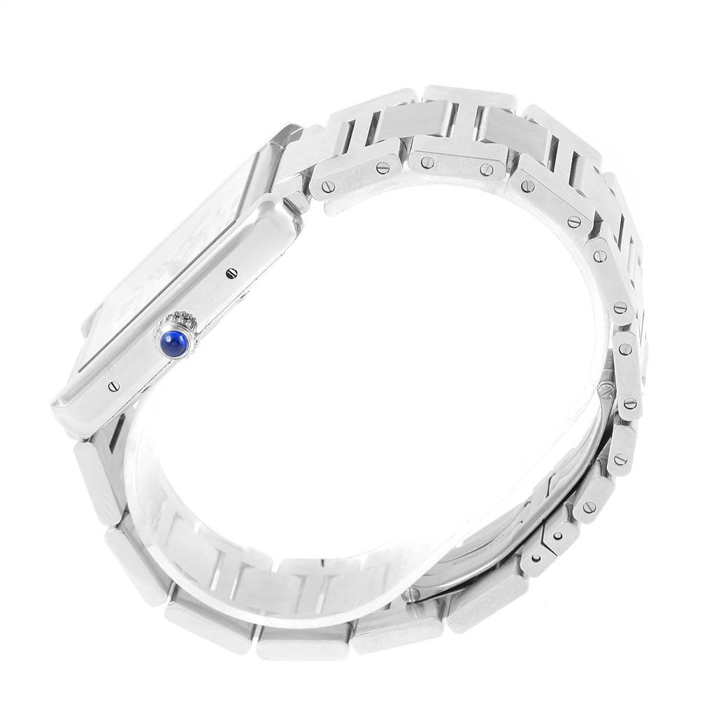 This image shows a side view of the Cartier Tank Solo W5200028 Men
s Stainless Steel Silver Dial W5200028 Men
s Stainless Steel Silver Dial watch, highlighting the bracelet and crown with a blue cabochon.