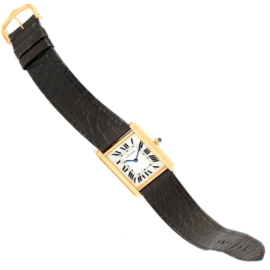 The image shows the Cartier Tank Solo W1018855 Steel and Gold (two tone) Silver Dial W1018855 Steel and Gold (two tone) Silver Dial watch at an angle showcasing its face, strap, and buckle.