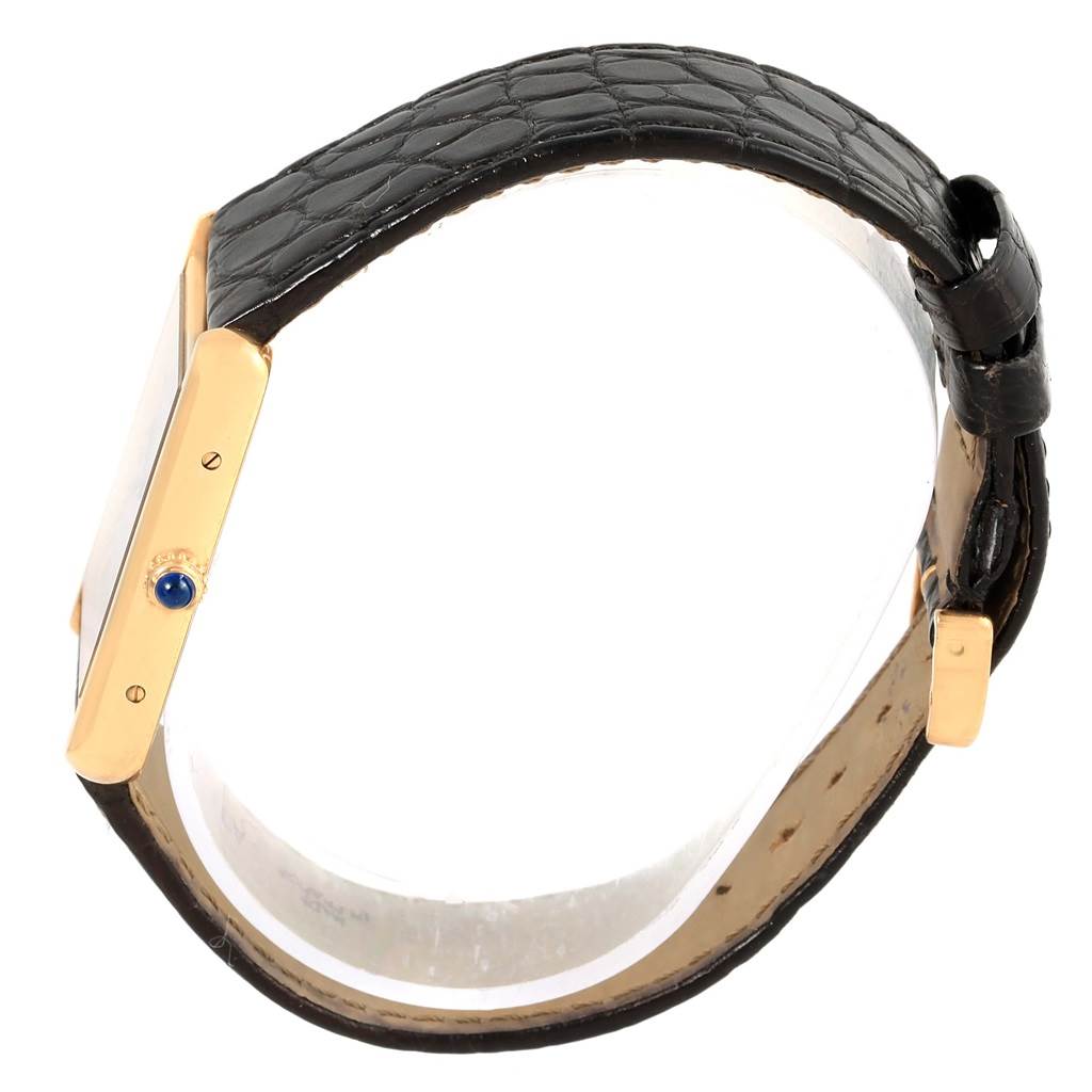 The image shows a Cartier Tank Solo W1018855 Steel and Gold (two tone) Silver Dial W1018855 Steel and Gold (two tone) Silver Dial watch from a top-side angle, highlighting the crown, bezel, and leather strap.